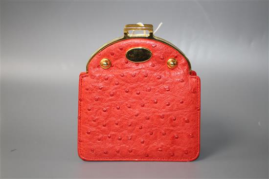 An Asprey red ostrich skin clutch purse, with gilt metal mount and padlock clasp, width 11cm height 12.5cm